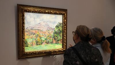 People view 'La Montagne Sainte-Victoire' by French artist Paul Cezanne, estimated in excess of 120 million USD, during a preview of the sale 'Visionary: The Collection of Paul G. Allen' at Christie's Auction House in New York, New York, USA, 31 October 2022. EPA / SARAH YENESEL