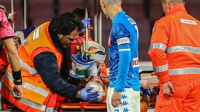 David Ospina is treated by medics after his head collision during a league match. AFP