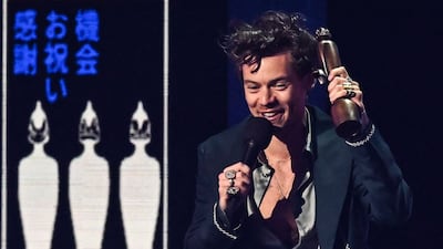 British singer Harry Styles celebrates after receiving the Album of the Year award for Harry's House during the Brit Awards 2023 ceremony and live show in London on February 11, 2023. AFP