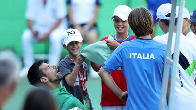 Serbia's Novak Djokovic takes a break while playing an exhibition match against Croatia's Ivan Dodig in Visoko, Bosnia. AP Photo