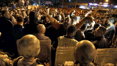 Supporters of Lebanese President Michel Aoun chant slogans, as Lebanese republican guards stand guard during a protest near the presidential palace in the Beirut suburb of Baabda. AP Photo