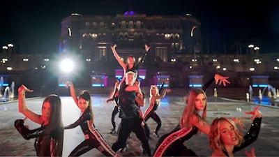 Members of Now United dance in front of Abu Dhabi's Emirates Palace in their latest music video. YouTube