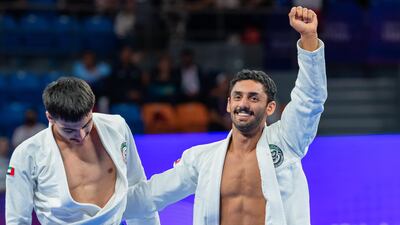 Khaled Al Shehi, right, celebrates his gold medal win over teammate Khalid Al Balooshi in the Asian Games on Thursday, October 5, 2023. Photo: UAEJJF