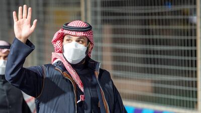 Saudi Crown Prince Mohammed Bin Salman waves as he arrives at Diriyah E-Prix 2021 in Riyadh, Saudi Arabia. Courtesy of Saudi Royal Court