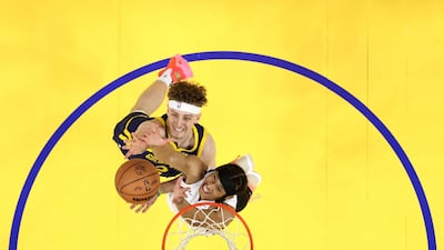 Brandin Podziemski of the Golden State Warriors and R J Hampton of the Miami Heat contest a rebound at Chase Centre in San Francisco, California. Getty Images
