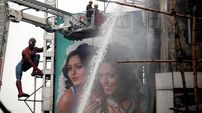 Firefighters battle to extinguish a huge fire on a shopping mall in central Calcutta. Piyal Adhikary / EPA