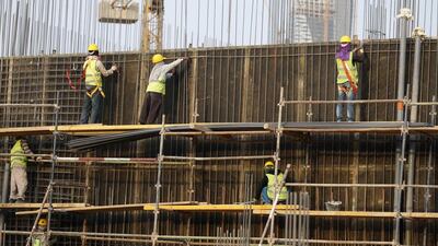 Indian labourers work at the construction site of a building in Riyadh. Thousands of laid-off Indian workers in the kingdom and Kuwait face food crisis, says India's government. Faisal Al Nasser / Reuters