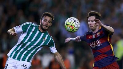 Barcelona’s Lionel Messi, right, competes for the ball with German Pezzella of Real Betis at Estadio Benito Villamarin on April 30, 2016 in Seville, Spain. Gonzalo Arroyo Moreno/Getty Images