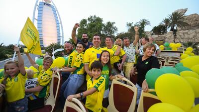 Norwich fans pass the Burj Al Arab on their open top bus tour of Dubai