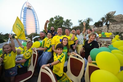 Norwich fans pass the Burj Al Arab on their open top bus tour of Dubai