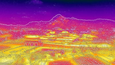 This image made with a thermal camera shows the Gyeongbokgung Palace and mountains behind, on a hot day in Seoul. AFP