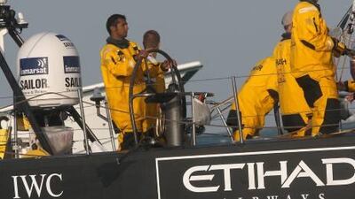 Emirati Adil Khalid guides Azzam into port in Abu Dhabi.