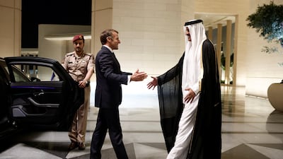 Sheikh Tamim, Emir of Qatar, welcomes French President Emmanuel Macron at the Lusail Palace in Doha on Tuesday. EPA