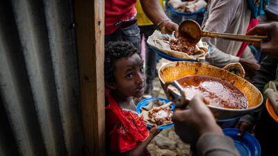 Displaced Tigrayans line up to receive food in northern Ethiopia. AP
