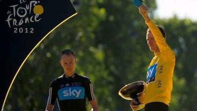 Team Sky's Bradley Wiggins, right, celebrates on the podium at the end of the 120km and last stage of the 2012 Tour de France after becoming the first Briton to win the famous race. Lionel Bonaventure / AFP