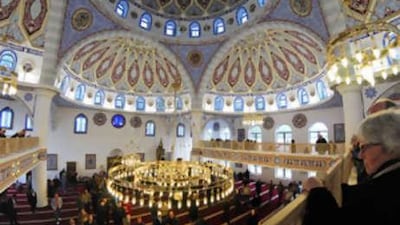 Visitors explore the prayer room of the Merkez Mosque, which opened last week in Duisburg.