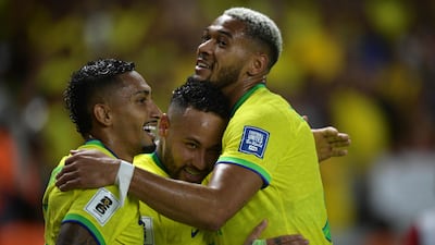 Neymar, centre, celebrates with teammates Raphinha, left, and Joelinton after scoring. AFP