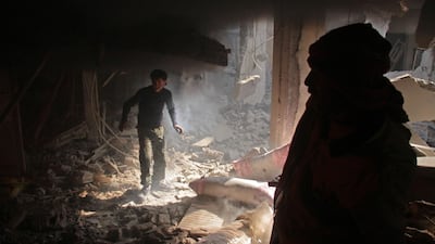 Syrians search for survivors following regime air strikes on the rebel-held besieged town of Douma in the eastern Ghouta region. AFP