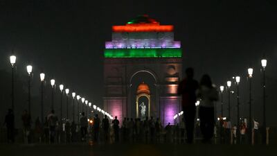 India Gate is illuminated with the colours of the national flag, on the eve of Independence Day in New Delhi. AFP