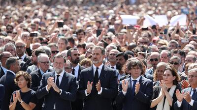 King Felipe of Spain and Prime Minister Mariano Rajoy observe a minute of silence in Placa de Catalunya, a day after a van crashed into pedestrians at Las Ramblas in Barcelona, Spain. Sergio Perez / Reuters.