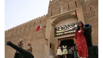 Tourists explore the Dubai Museum.