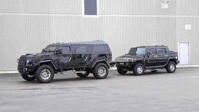 A Hummer H2 sits behind a Knight XV. William Maizlin