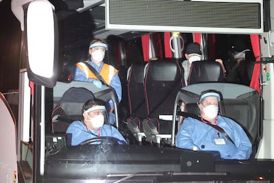 British Nationals arrive by coach at Arrowe Park Hospital in Wirral, north west England. AFP