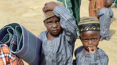 Muslim boys arrive with a prayer mat at the Isa Kazaure praying ground in Nigeria’s central city of Jos to mark Eid Al Fitr, the end of the Muslim fasting month of Ramadan. Pius Utomi Ekpei / AFP photo