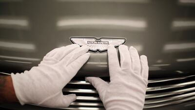 An Aston Martin Vanquish is inspected by hand at the company headquarters and production plant in 2013, Gaydon.