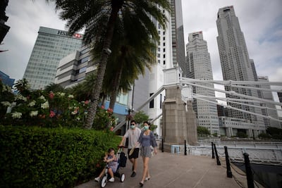 A family walk through Singapore's Central Business District. EPA