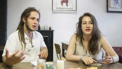 Polly Akhurst, right, and David Blackwell, co-founders of Talk To Me London, a new campaign that wants to change London’s image as one of the loneliest places in Britain. Volunteers are handing out special badges with the message 'Talk to me, I’ll talk to you' - an invitation to strike up a conversation with the wearer, anywhere. Bogdan Maran/AP Photo