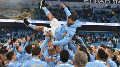 Sergio Aguero is thrown in the air by Manchester City teammates after his last home match for the club against Everton at the Etihad Stadium on Sunday, May 23. EPA