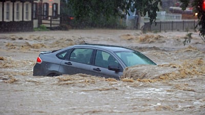 A parked car is flooded in a lot near Main Street and Ellicott Mills Road as a heavy storm caused flash floods in Ellicott City, Maryland, USA, 27 May 2018. Roaring flash floods struck the Maryland city Sunday that had been wracked by similar devastation two years ago, its main street turned into a raging river that reached the first floor of some buildings and swept away parked cars, authorities and witnesses say. Kenneth K. Lam / AP Photo