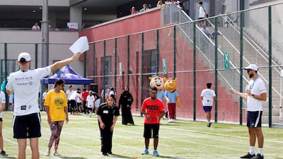 Children participating in track and field at the Infinity Games. Leslie Pableo / The National