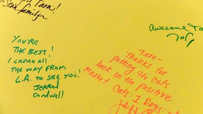 Messages are seen on a greeting card for Tara.