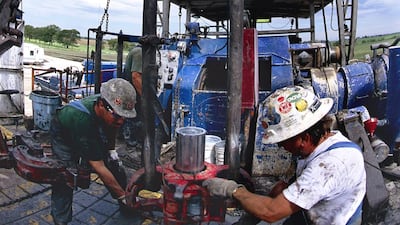 Workers at a Mitchell Energy gas well near Ponder, Texas. George Mitchell’s company was among the first to yield gas from the US Barnett formation, marking the beginning of the shale age in America. Greg Smith / Corbis