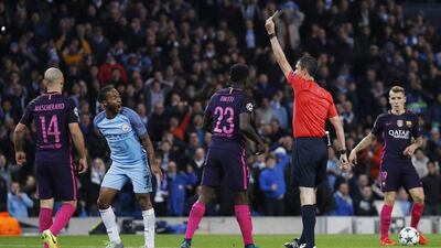 Manchester City forward Raheem Sterling protests after getting booked by referee Viktor Kassai for diving in the penalty area. Phil Noble / Reuters