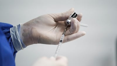 A healthcare worker fills a syringe with a dose of the Pfizer-BioNTech Covid-19 vaccine at The University Hospital of La Samaritana in Zipaquira, Colombia, February 18, 2021. Bloomberg