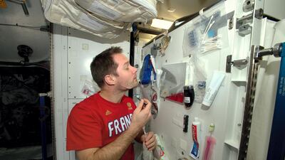 European Space Agency astronaut Thomas Pesquet shaves on board the station. ESA / AFP