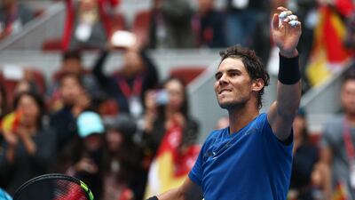 Rafael Nadal salutes the crowd after his win over John Isner in the China Open quarter-final on Friday. Wu Hong / EPA