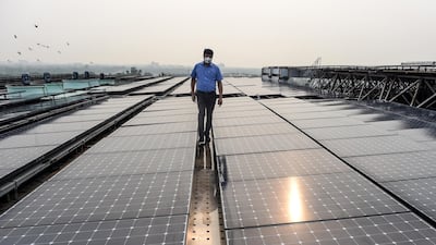 An employee walks among solar panels installed on the building of Indira Paryavaran Bhawan or the Indian Environment Ministry in New Delhi. Source's regional vice president Vahid Fotuhi sees parallels in the evolution of the hydropanel technology to that of solar photovoltaic panels. AFP