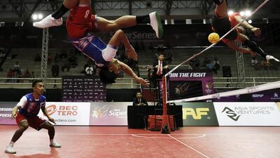Malaysia’s Khairol Zaman (2nd L) in action against The Philippines’s Rheyjhey Ortouste (R) during their semi final match. Asia Sports Ventures / Action Images via Reuters