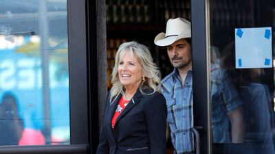 Jill Biden, in a zebra-print dress and jacket, attends a vaccination pop-up in Nashville with singer Brad Paisley on June 22, 2021. AFP