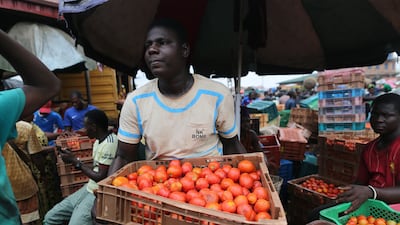 A vendor at the Mile 12 International food market in Lagos, Nigeria. EPA
