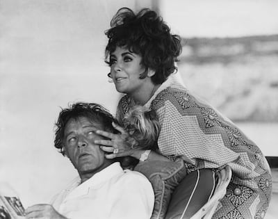 Richard Burton and Elizabeth Taylor on their yacht Kalizma near Sardinia in 1967. Getty Images