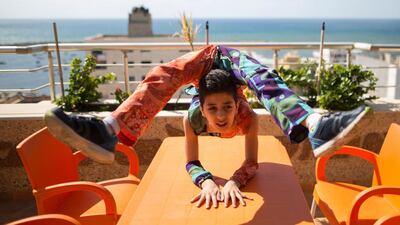 Though he did not win the talent competition, he now hopes to writhe his way into the Guinness Book of Records from his home in the Tel Al Hawa area of southern Gaza City. Mahmud Hams / AFP