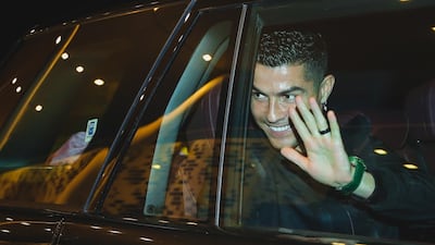 Cristiano Ronaldo waves to supporters.