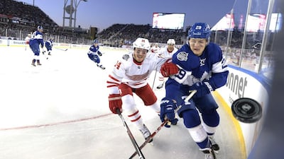 Toronto Maple Leafs centre William Nylander and Detroit Red Wings right wing Gustav Nyquist chase the puck along the corner boards. Frank Gunn / AP