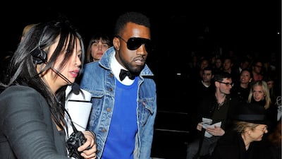 Kanye West, in a bow tie and denim jacket, attends the Narciso Rodriguez fashion show at Mercedes-Benz Fashion Week in New York City on February 17, 2009. EPA