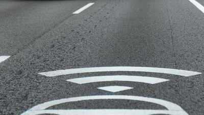 A car travels along a lane marked for future use by autonomous vehicles in Girona, Spain. AFP